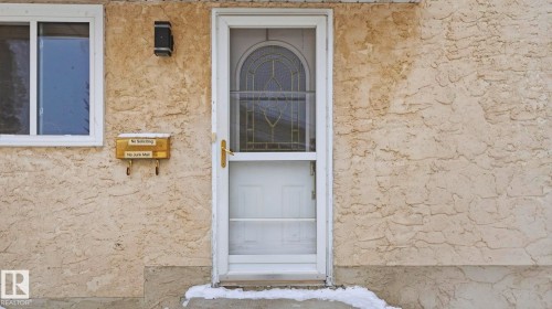 Entrance to property featuring stucco siding - 4502 50A Avenue, Beaumont, AB - Outdoor With Exterior