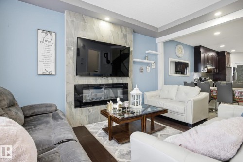 1005 Mcconachie Boulevard, Edmonton, AB - Indoor Photo Showing Living Room With Fireplace