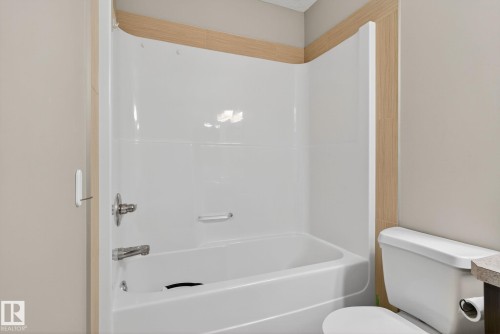 Bathroom with bathtub / shower combination and vanity - 1717 Chapman Way, Edmonton, AB - Indoor Photo Showing Bathroom