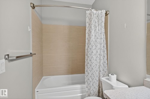 Full bath featuring shower / bath combo and vanity - 1717 Chapman Way, Edmonton, AB - Indoor Photo Showing Bathroom