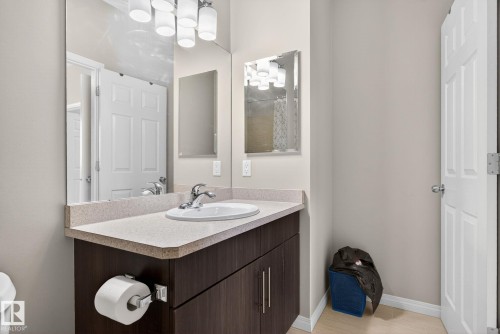 Bathroom featuring vanity, light wood-style floors, and tiled shower - 1717 Chapman Way, Edmonton, AB - Indoor Photo Showing Bathroom