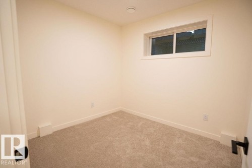 Unfurnished room featuring carpet flooring and baseboards - 11738 91 Street Nw, Edmonton, AB - Indoor Photo Showing Other Room