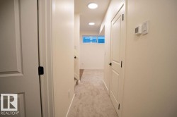 Hall featuring light carpet and recessed lighting - 