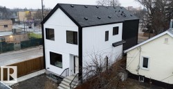 View of side of home featuring roof with shingles and a central air condition unit - 