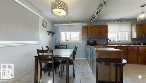 Dining room featuring baseboards - 4706 53 St, Leduc, AB - Indoor