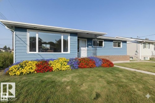 Single story home with a front yard and brick siding - 4706 53 St, Leduc, AB - Outdoor