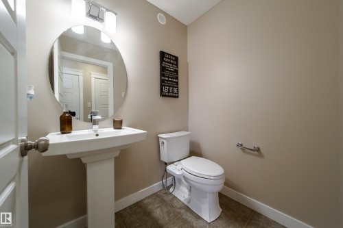 Half bath featuring toilet and tile patterned flooring - 2919 15 Street, Edmonton, AB - Indoor Photo Showing Bathroom