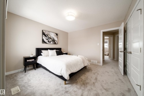 Bedroom with light carpet and baseboards - 2919 15 Street, Edmonton, AB - Indoor Photo Showing Bedroom