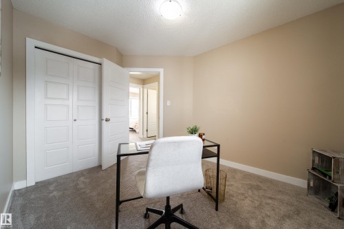 Carpeted home office featuring a textured ceiling and baseboards - 2919 15 Street, Edmonton, AB - Indoor Photo Showing Office