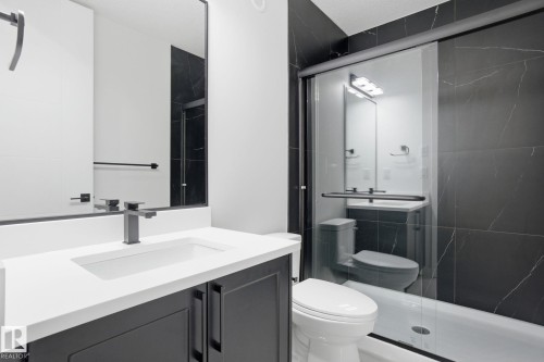 Bathroom featuring vanity and a stall shower - 3294 Chernowski Way, Edmonton, AB - Indoor Photo Showing Bathroom