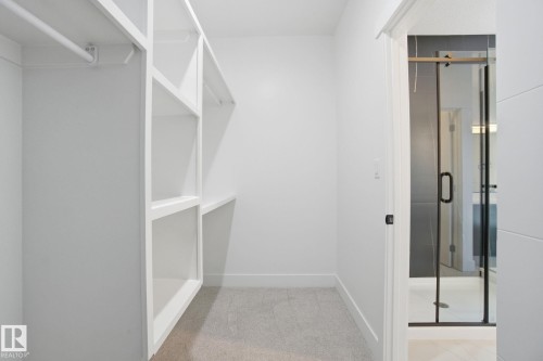 Walk in closet featuring light carpet - 3294 Chernowski Way, Edmonton, AB - Indoor Photo Showing Other Room