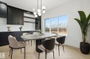 Dining room with a chandelier and parquet floors - 3294 Chernowski Way, Edmonton, AB  - Indoor Photo Showing Dining Room 