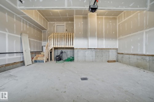 Garage with a garage door opener - 3294 Chernowski Way, Edmonton, AB - Indoor