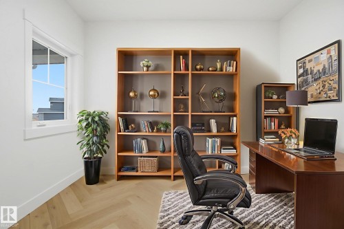 Home office with parquet flooring and baseboards - 3294 Chernowski Way, Edmonton, AB - Indoor Photo Showing Office