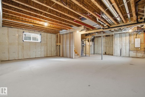 Basement featuring stairs and electric panel - 3294 Chernowski Way, Edmonton, AB - Indoor Photo Showing Basement