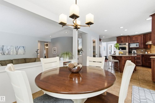 Dining room with light tile patterned floors and recessed lighting - 326 O'Connor Close, Edmonton, AB - Indoor Photo Showing Dining Room