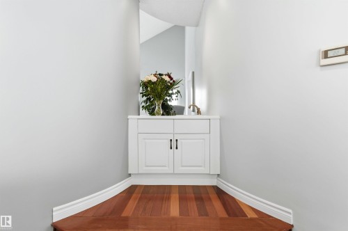 Hallway with dark wood-type flooring and baseboards - 326 O'Connor Close, Edmonton, AB - Indoor Photo Showing Other Room