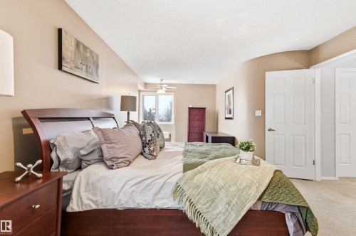 Bedroom featuring light colored carpet, a ceiling fan, and a textured ceiling - 326 O'Connor Close, Edmonton, AB - Indoor Photo Showing Bedroom