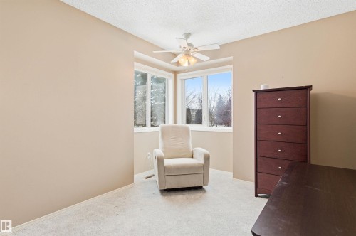 Sitting room featuring light carpet, a textured ceiling, and a ceiling fan - 326 O'Connor Close, Edmonton, AB - Indoor