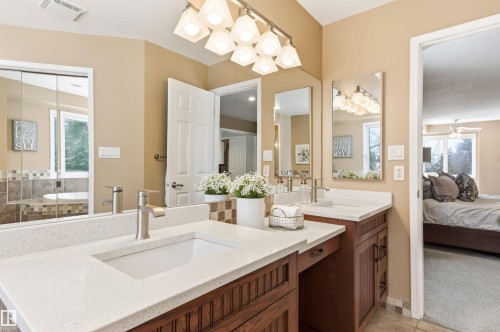 Ensuite bathroom featuring healthy amount of natural light and two vanities - 326 O'Connor Close, Edmonton, AB - Indoor Photo Showing Bathroom