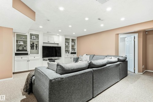 Living area with light colored carpet, recessed lighting, and built in features - 326 O'Connor Close, Edmonton, AB - Indoor