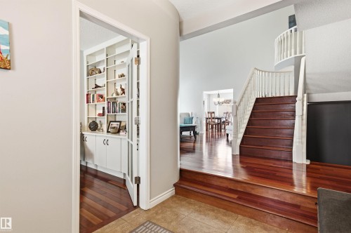 Foyer featuring light wood-style flooring, suspended lighting, and a textured ceiling - 326 O'Connor Close, Edmonton, AB - Indoor Photo Showing Other Room