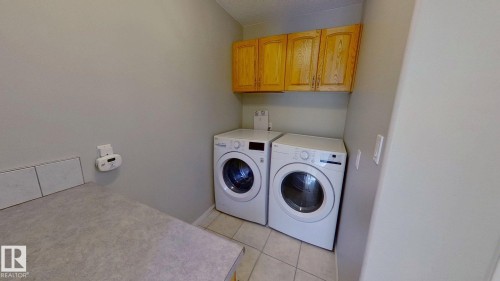 24 Pipestone Drive, Devon, AB - Indoor Photo Showing Laundry Room