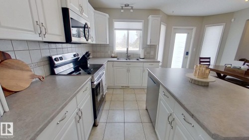 24 Pipestone Drive, Devon, AB - Indoor Photo Showing Kitchen With Double Sink