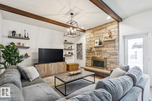 3021 105A Street, Edmonton, AB - Indoor Photo Showing Living Room With Fireplace