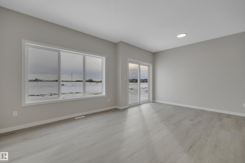 Empty room featuring light wood-style flooring and recessed lighting - 5657 Hawthorn Way, Edmonton, AB - Indoor Photo Showing Other Room