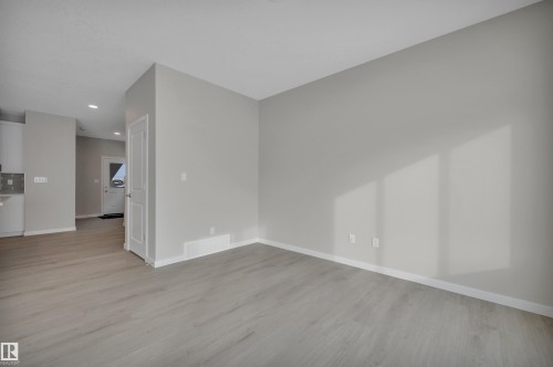 Empty room with light wood-style flooring and recessed lighting - 5657 Hawthorn Way, Edmonton, AB - Indoor Photo Showing Other Room