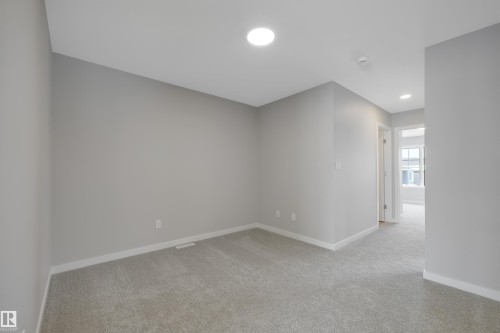 Empty room with light carpet and recessed lighting - 5657 Hawthorn Way, Edmonton, AB - Indoor Photo Showing Other Room