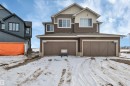 View of front of house with a garage and a shingled roof - 5657 Hawthorn Way, Edmonton, AB  - Outdoor 
