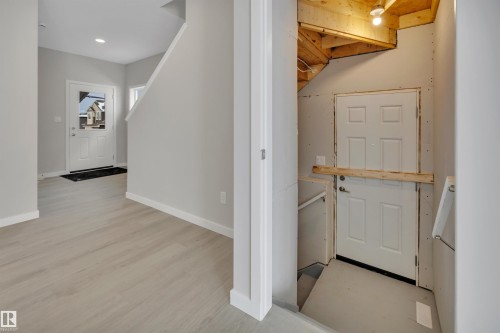 Foyer with light wood-style floors and recessed lighting - 5657 Hawthorn Way, Edmonton, AB - Indoor Photo Showing Other Room