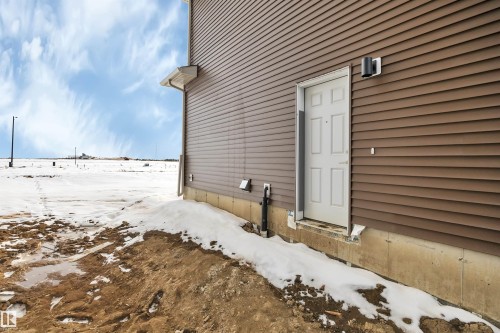 View of snow covered exterior - 5657 Hawthorn Way, Edmonton, AB - Outdoor With Exterior