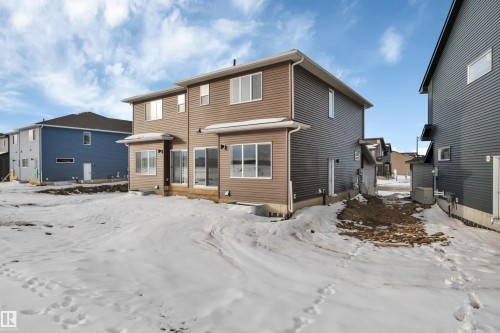View of snow covered rear of property - 5657 Hawthorn Way, Edmonton, AB - Outdoor With Exterior