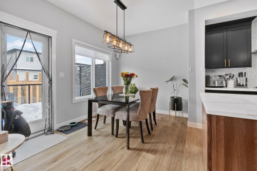 Dining area with light wood-type flooring - 324 41 Street, Edmonton, AB - Indoor Photo Showing Dining Room