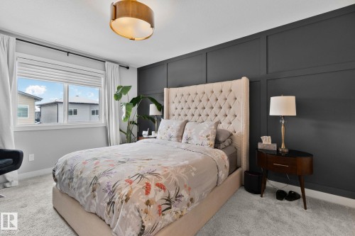 Bedroom with a decorative wall and light colored carpet - 324 41 Street, Edmonton, AB - Indoor Photo Showing Bedroom