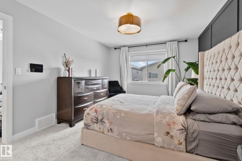 Bedroom with carpet flooring and baseboards - 324 41 Street, Edmonton, AB - Indoor Photo Showing Bedroom
