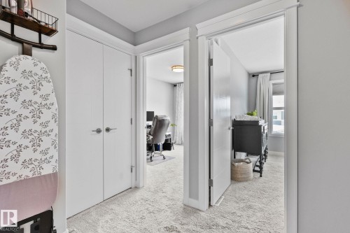 Hallway featuring a desk and light colored carpet - 324 41 Street, Edmonton, AB - Indoor Photo Showing Other Room
