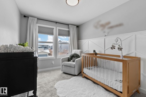 Bedroom with carpet and a crib - 324 41 Street, Edmonton, AB - Indoor Photo Showing Bedroom
