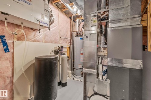 Utility room featuring heating unit and water heater - 324 41 Street, Edmonton, AB - Indoor Photo Showing Basement