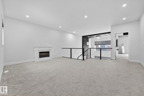 4413 39 Street, Beaumont, AB - Indoor Photo Showing Other Room With Fireplace