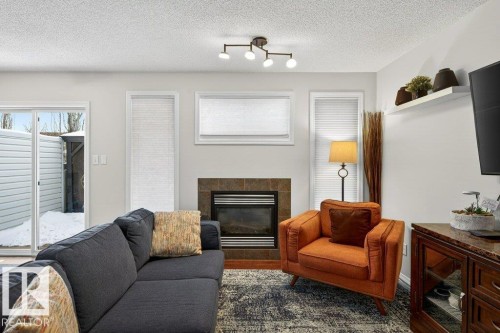 3457 11 Street, Edmonton, AB - Indoor Photo Showing Living Room With Fireplace