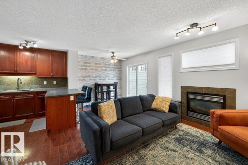 3457 11 Street, Edmonton, AB - Indoor Photo Showing Living Room With Fireplace