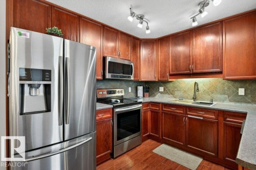 3457 11 Street, Edmonton, AB - Indoor Photo Showing Kitchen With Stainless Steel Kitchen