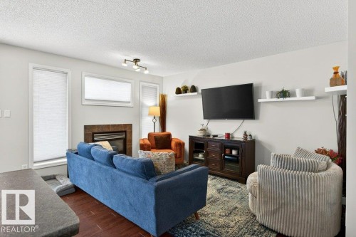3457 11 Street, Edmonton, AB - Indoor Photo Showing Living Room With Fireplace