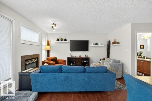3457 11 Street, Edmonton, AB - Indoor Photo Showing Living Room With Fireplace