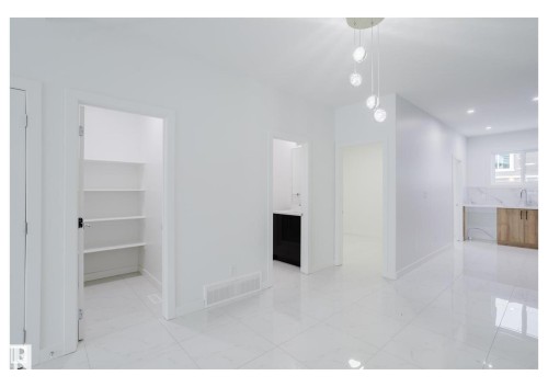 Unfurnished dining area featuring light marble finish flooring and recessed lighting - 231 25 Street Sw, Edmonton, AB - Indoor Photo Showing Other Room