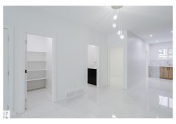 Unfurnished dining area featuring light marble finish flooring and recessed lighting - 